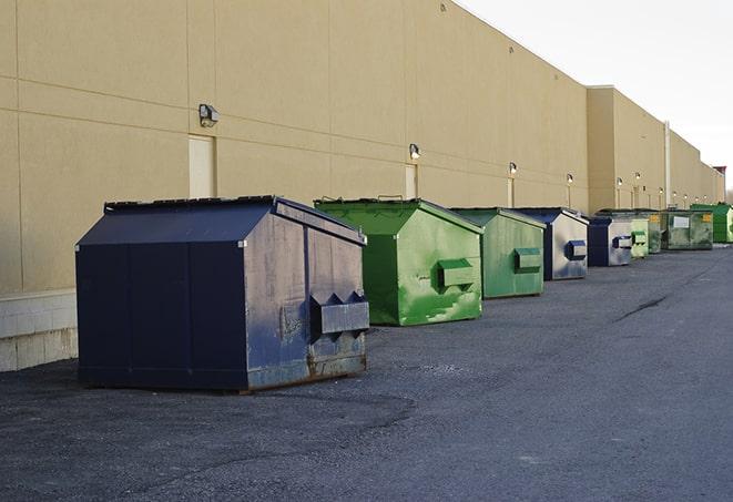 a fleet of red and blue construction dumpsters available for use in Good Thunder, MN